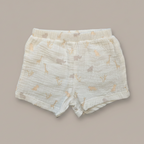 Baby shorts with animal pattern on a beige background