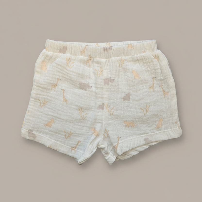 Baby shorts with animal pattern on a beige background