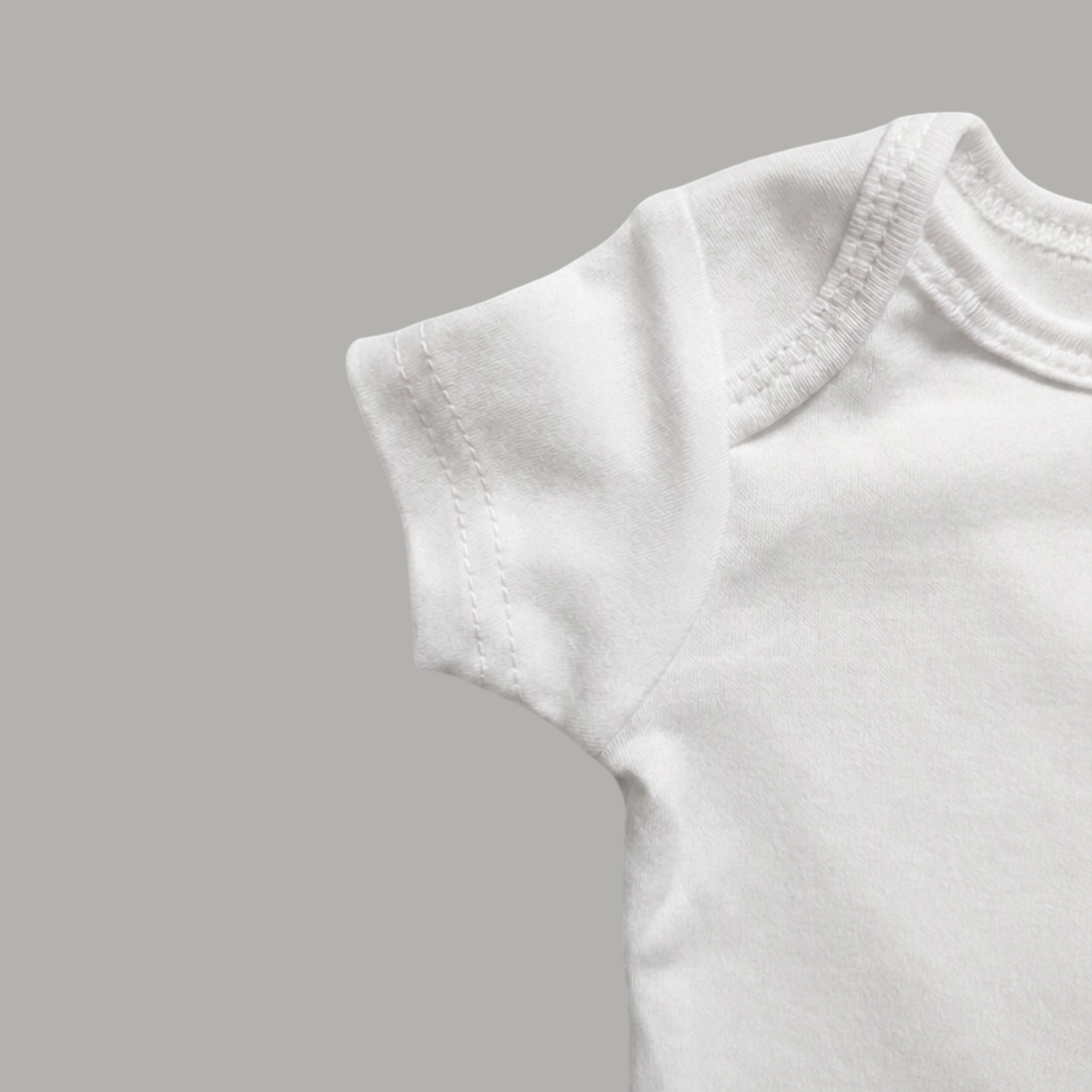 White cotton short-sleeve baby bodysuit sleeve