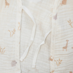 Close-up of a fabric with a subtle pattern and elastic waistband.