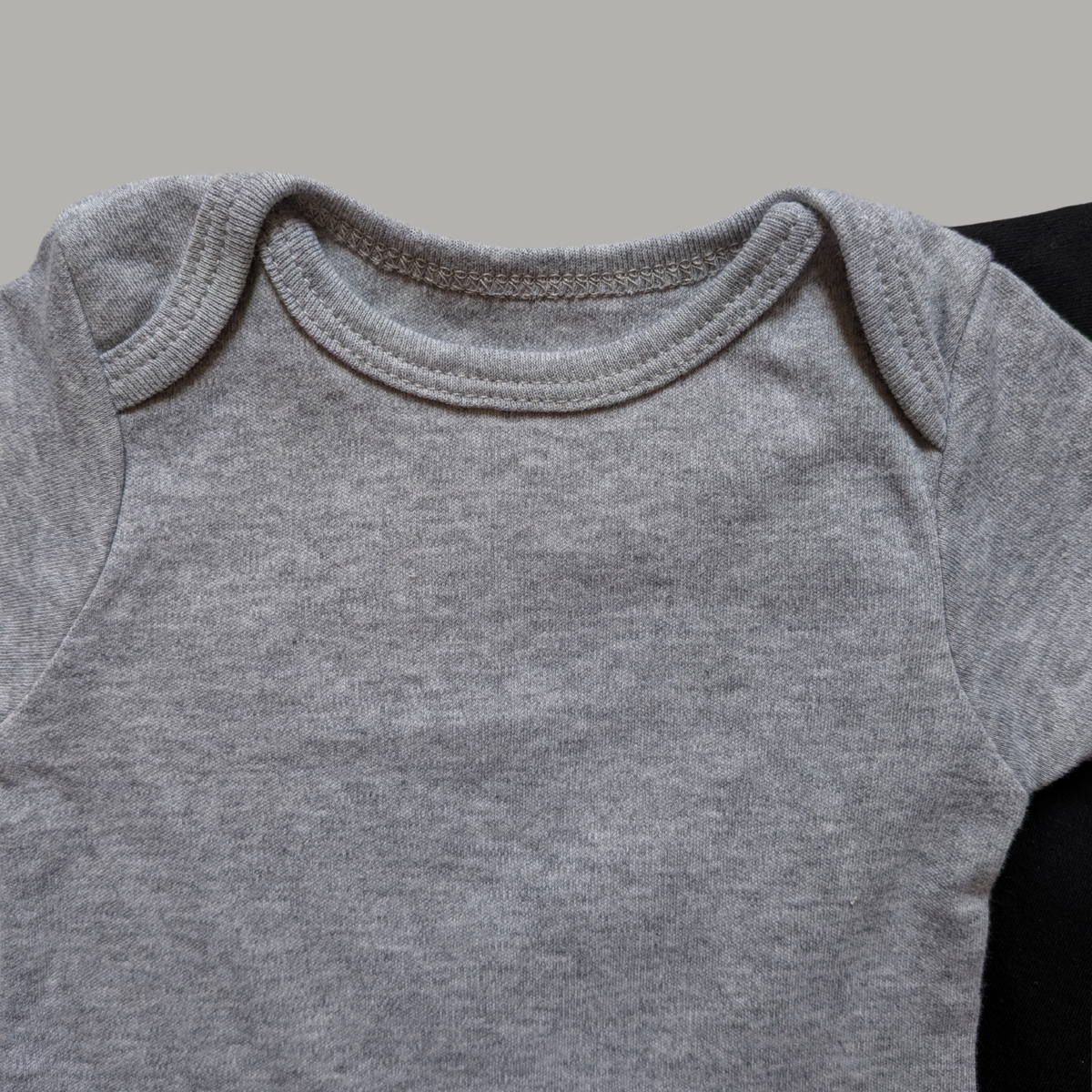 Light grey short-sleeve cotton baby bodysuit crew neck collar