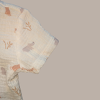 Textured fabric with animal patterns on a beige background