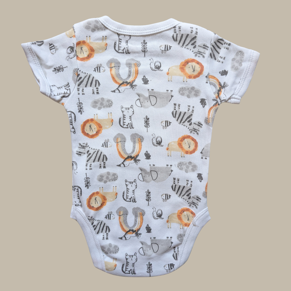 Baby bodysuit with a white base and an all-over safari animal print including zebra, lion, insect, and bird motifs in grey, black, orange, and beige.