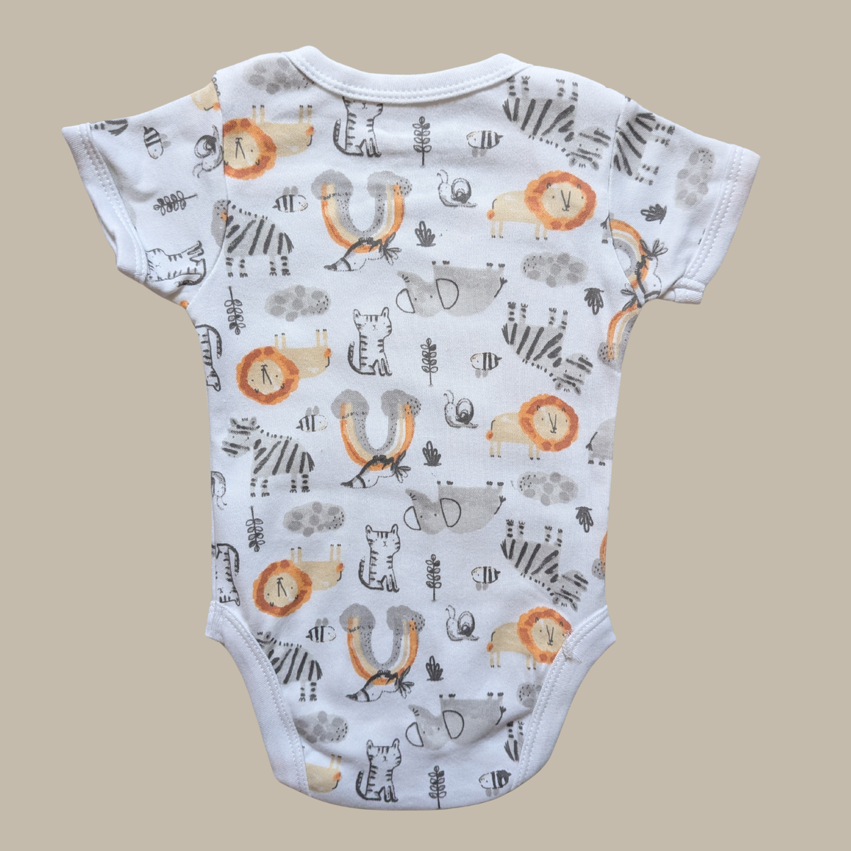 Baby bodysuit with a white base and an all-over safari animal print including zebra, lion, insect, and bird motifs in grey, black, orange, and beige.