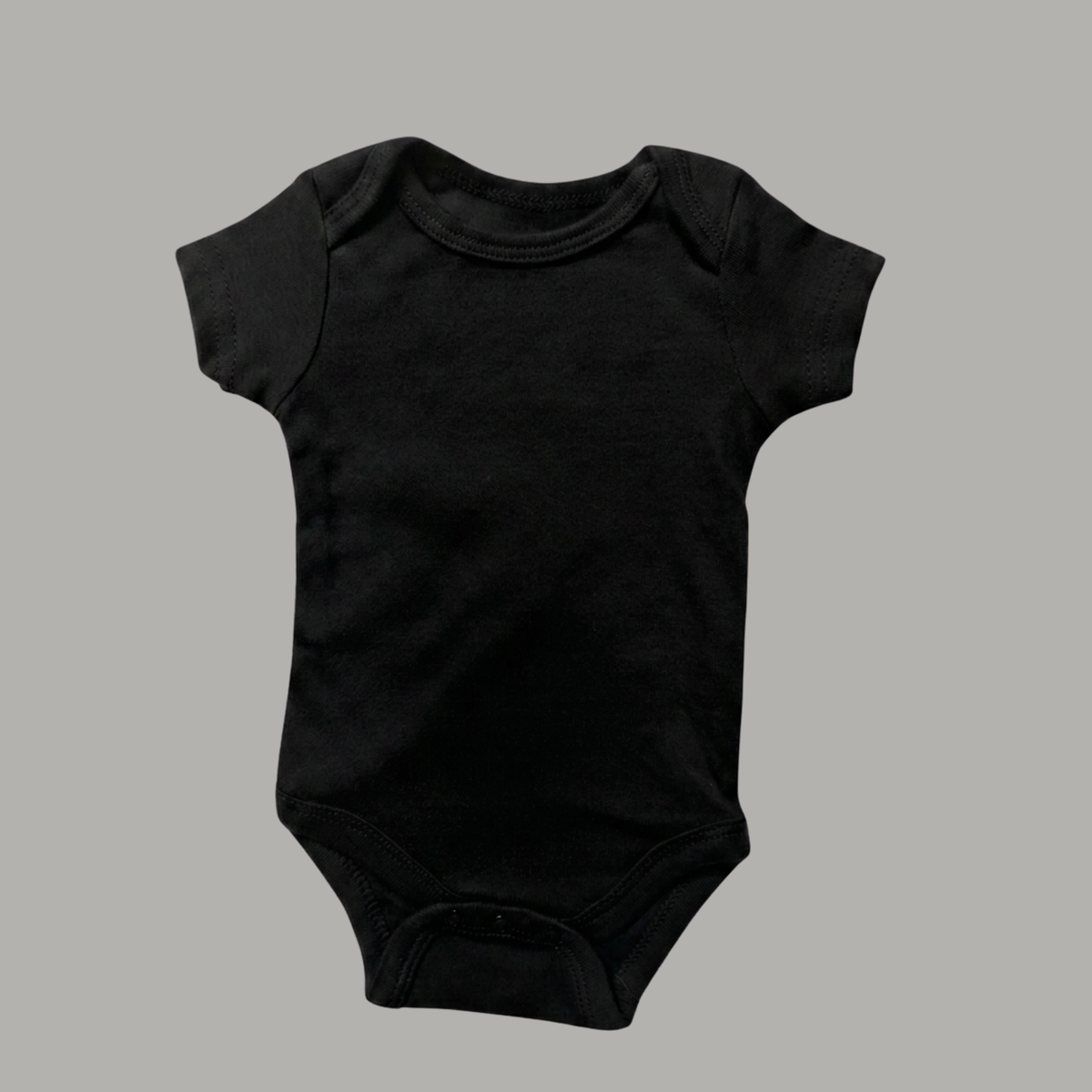 A plain black short-sleeve cotton baby bodysuit with a crew neck and snap crotch