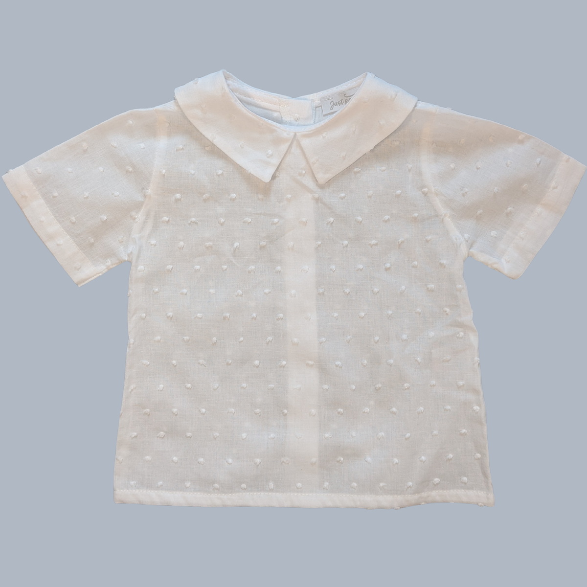 White blouse with a collar on a light gray background