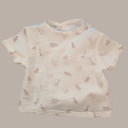 Baby t-shirt with animal pattern on a beige background
