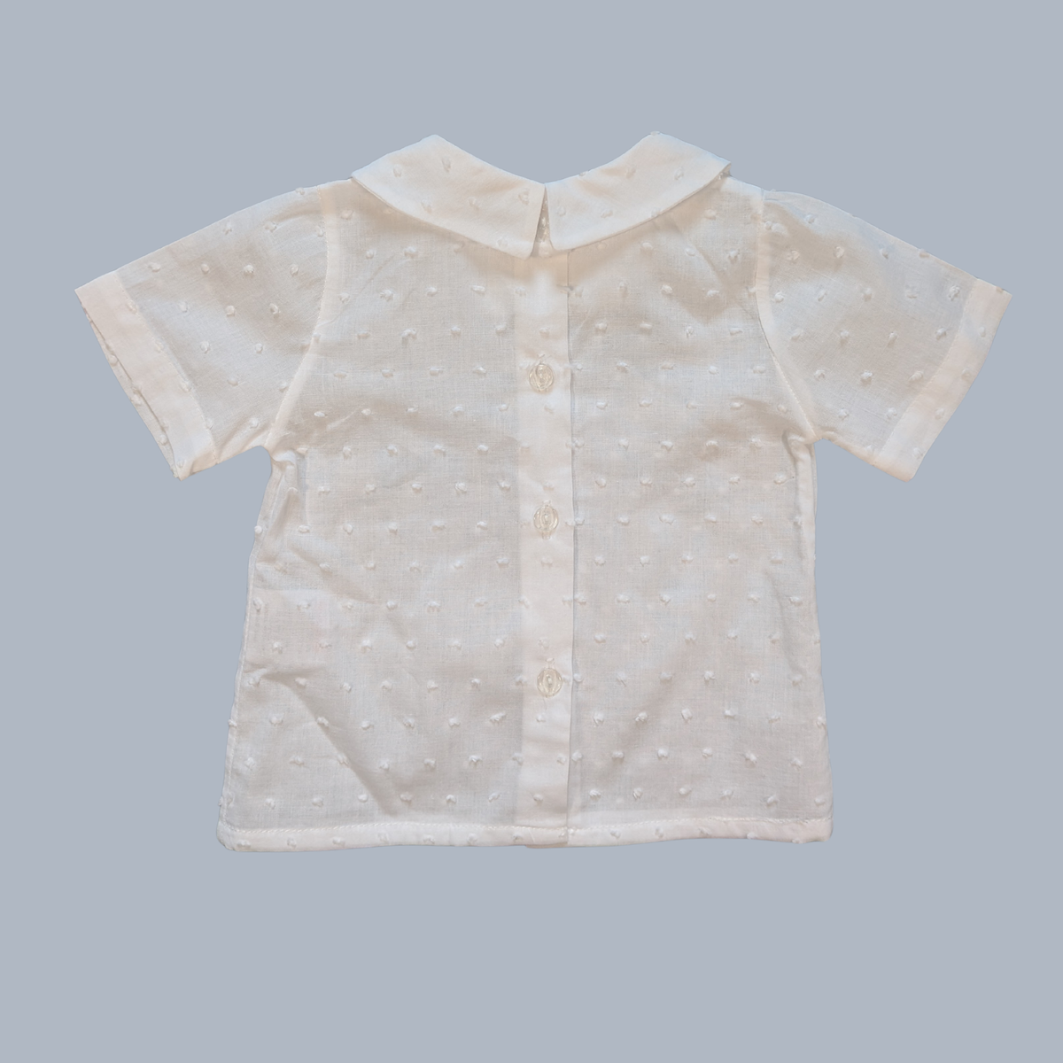 White short-sleeve shirt with a collar on a gray background