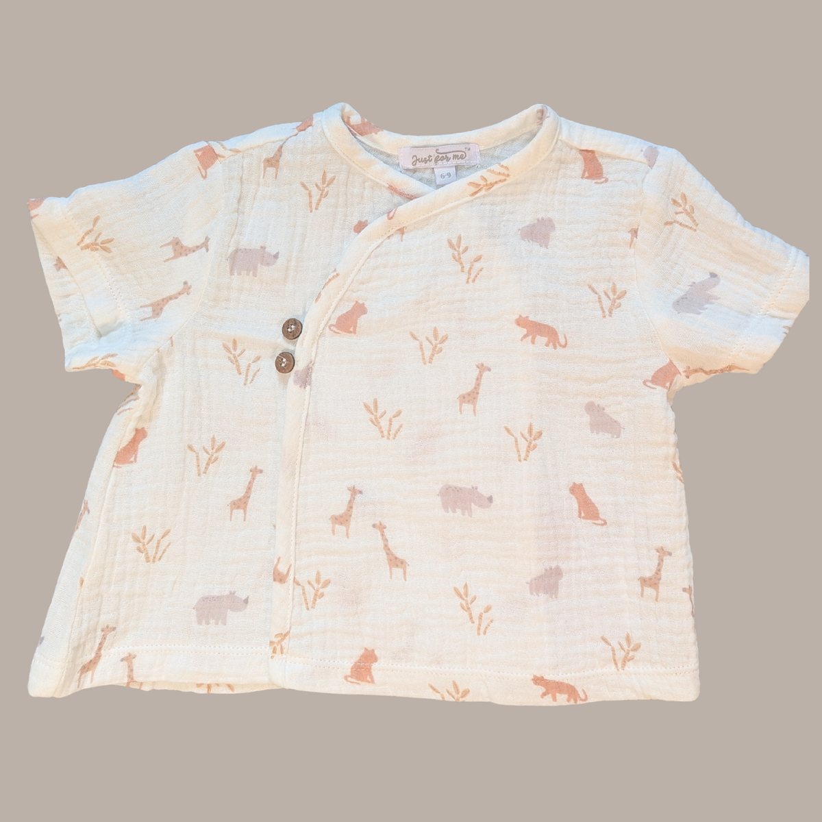 Baby shirt with animal pattern on a gray background