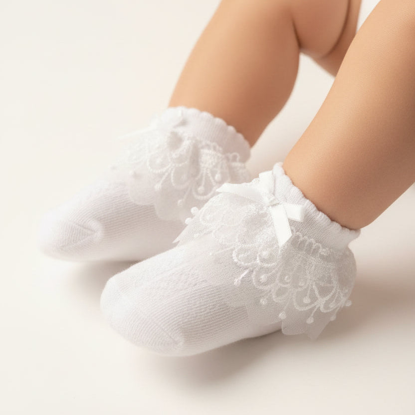 White lace-trimmed socks on a light surface